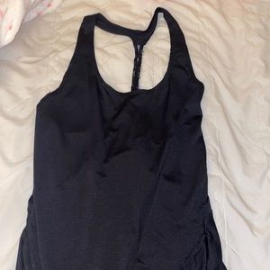 Black workout tank top with a thin sheer strap that goes down the back! Avía❣️